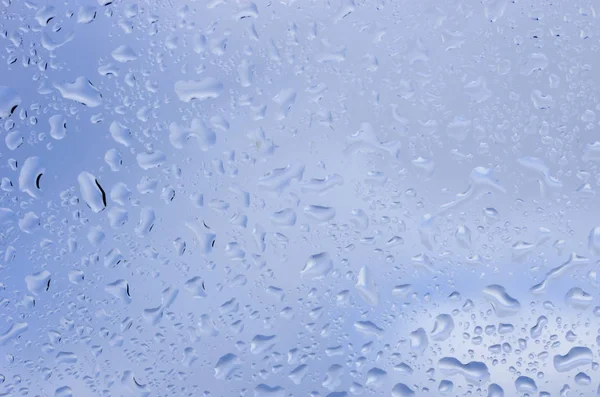 Gotas Agua Sobre Vidrio Contra Cielo Azul —  Fotos de Stock