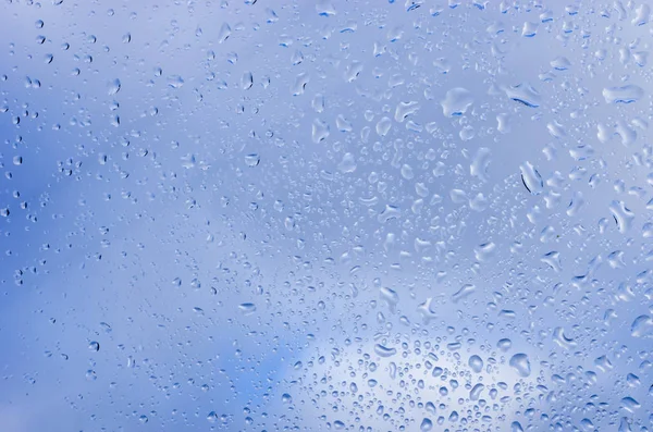 Gotas Agua Sobre Vidrio Contra Cielo Azul —  Fotos de Stock