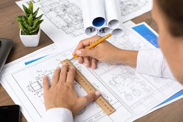 Architectural blueprints - drawings, pencil, calculator, calculations, plan, ruler, computer. Business and science.