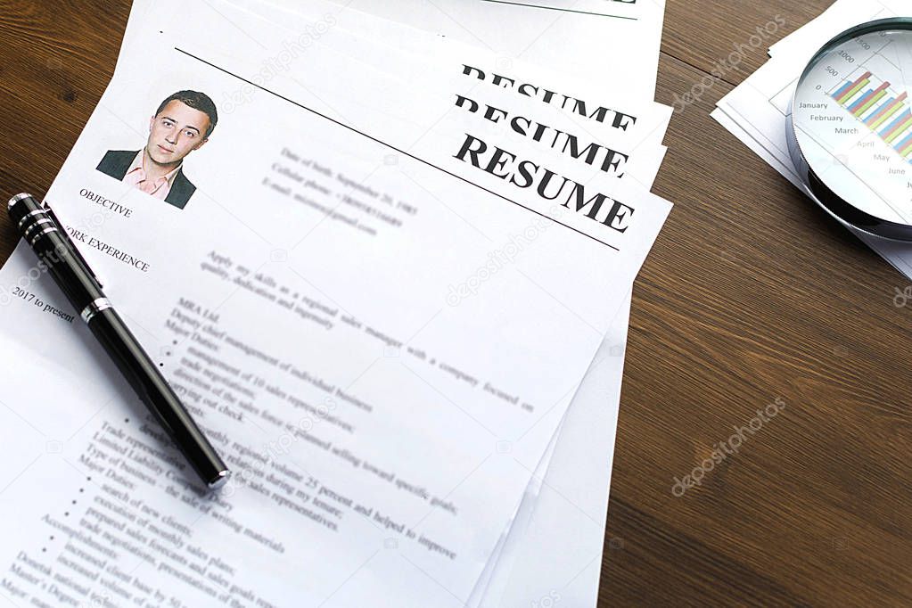 Resume (autobiography), pen, magnifier, laptop on your desktop. job search 