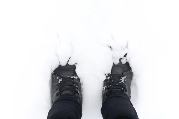 Sports winter boots in the snow.