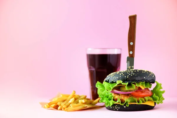 Fast food banner. Juicy meat burgers with cheese, lettuce on pink background. Take away meal. Unhealthy diet concept with copy space.