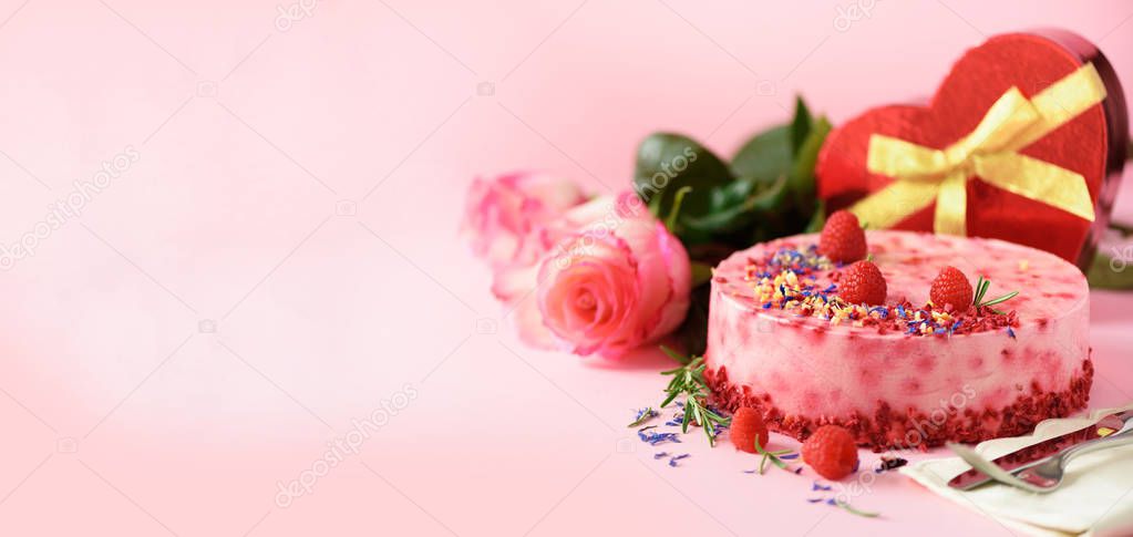 Gift boxes in shape of heart, roses, raspberry cake with fresh berries, rosemary and dry flowers on pink background. Banner, copy space. Valentine's Day concept. Present with love.