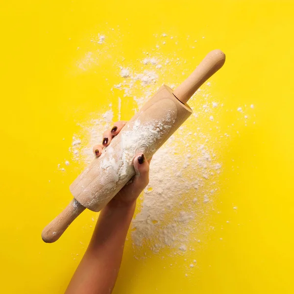 Baking flat lay with rolling pin, flour on yellow paper background. Bake menu, recipe, homemade pastry concept. Top view. Banner with copy space for your text. Square crop