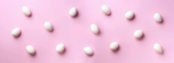 Food concept with white chicken eggs on pink background. Top view. Creative pattern in minimal style. Flat lay. Colorful banner — 스톡 사진