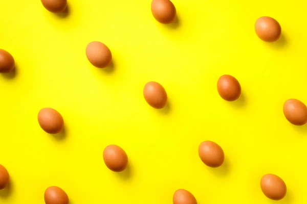 Food concept with white chicken eggs on yellow background. Top view. Creative pattern in minimal style. Flat lay. — 스톡 사진