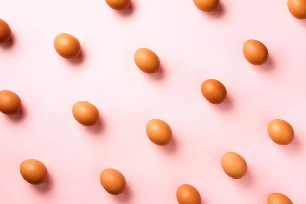 Food concept with chicken eggs on pink background. Top view. Creative pattern in minimal style. Flat lay. — 스톡 사진