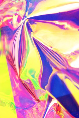 Holografik yanardöner yüzey. Uzayı kopyala Parlak renkli hologram geçmişi. Birden fazla renkle buruşmuş soyut doku. Neon yüzeyi.