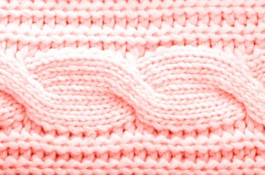 Örülmüş doku. Moda mercan renginde yün desenli kumaş. Arkaplan, boşluğu kopyala