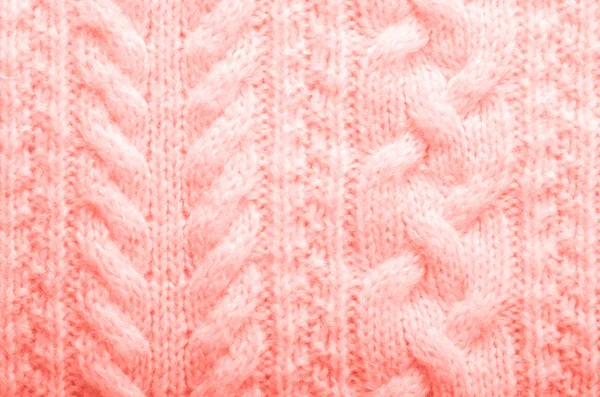 Textura tricotada. Tecido padrão feito de lã na cor de coral na moda. Fundo, espaço de cópia — Fotografia de Stock
