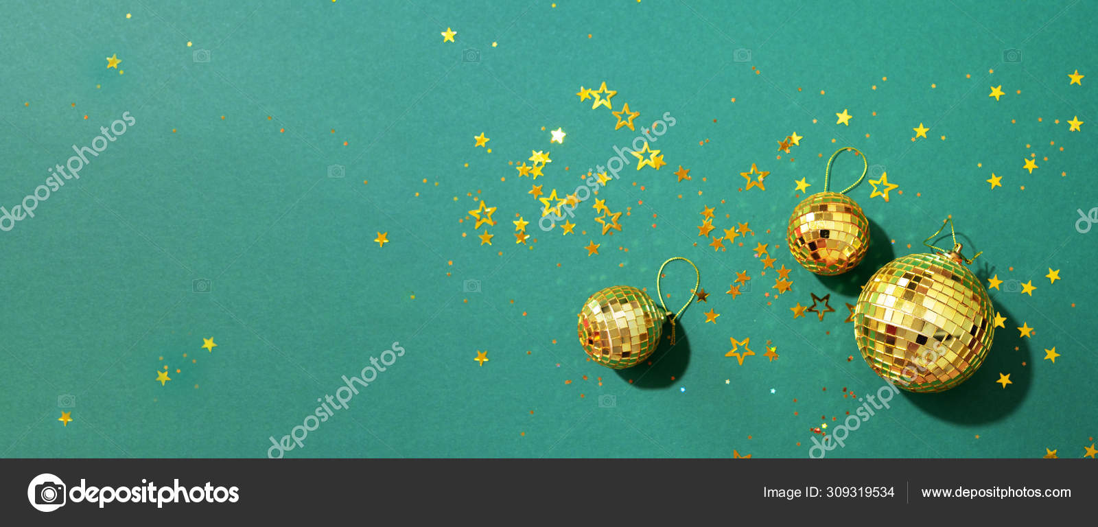 Creative Christmas concept. Shiny gold disco balls over green background.  Flat lay, top view. New year baubles, star sparkles. Party time. Greeting  card Stock Photo by ©j.chizhe 309319534