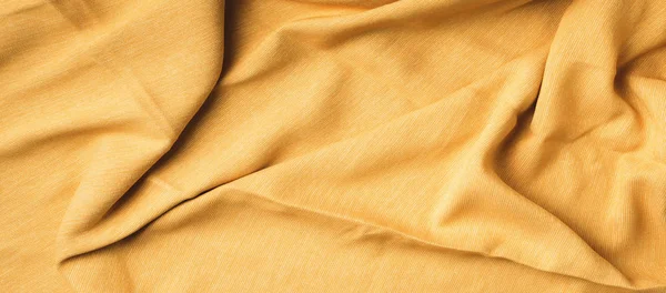 Sarı kumaş dokusu arka plan. Kumaş tekstil yüzeyinin en üst görüntüsü. Tasarım için soyut arkaplan — Stok fotoğraf