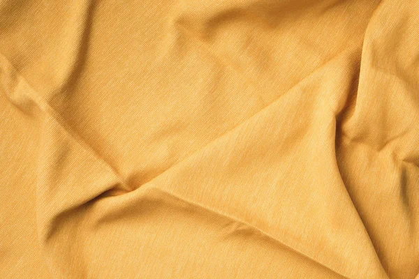 Sarı kumaş dokusunun arka plan dokusu. Uzayı kopyala Kumaş tekstil yüzeyinin en üst görüntüsü. Tasarım için soyut arkaplan. — Stok fotoğraf