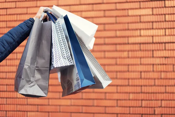 Man with bunch of shopping bags. Copy space. Sale, discount, black friday concept. Shopping mall and outlet — Stock Photo, Image