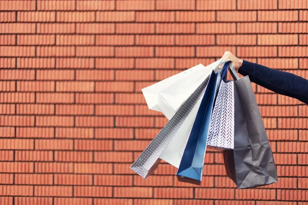 Sale, discount, black friday concept. Man with bunch of shopping bags. Copy space. Shopping mall and outlet — Stock Photo, Image