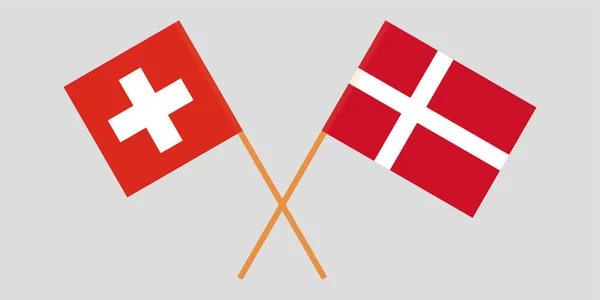 Suíça e Dinamarca. Bandeiras cruzadas suíças e dinamarquesas. Cores oficiais. Proporção correcta. Vetor — Vetor de Stock