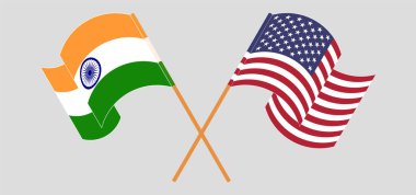 Crossed and waving flags of India and the USA clipart