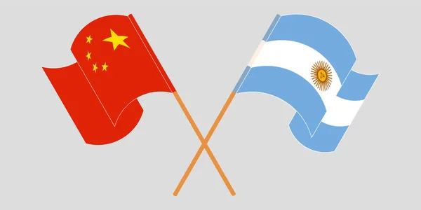 阿根廷和中国的横渡和飘扬的国旗 — 图库矢量图片