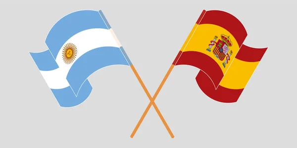 Argentína és Spanyolország keresztezett és lengő lobogói — Stock Vector