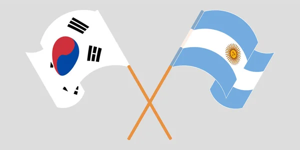 Bandeiras cruzadas e onduladas da Argentina e da Coreia do Sul — Vetor de Stock