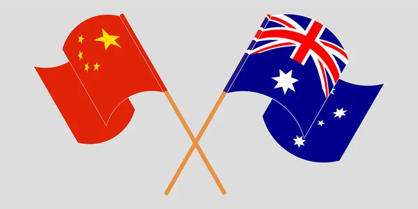 Gekruiste en wapperende vlaggen van Australië en China — Stockvector