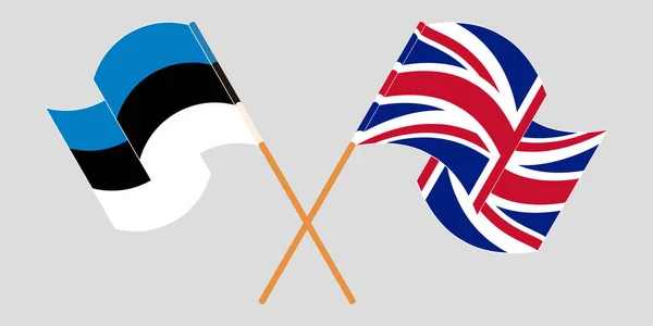 Korsade och viftande flaggor från Estland och Storbritannien — Stock vektor