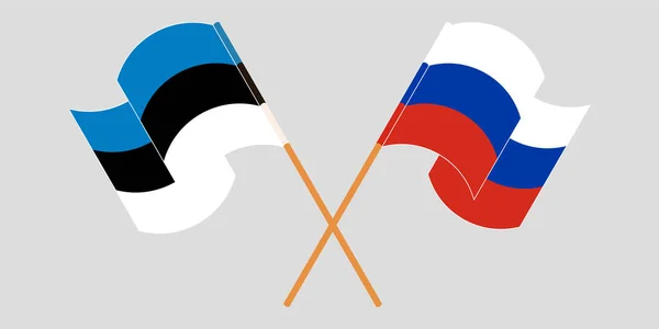 Banderas cruzadas y ondeando de Estonia y Rusia — Vector de stock