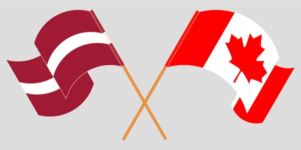 Banderas cruzadas y ondeando de Letonia y Canadá — Vector de stock