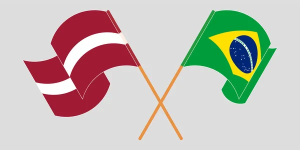 Bandeiras cruzadas e onduladas da Letónia e do Brasil — Vetor de Stock