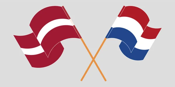 Bandeiras cruzadas e onduladas da Letónia e dos Países Baixos — Vetor de Stock
