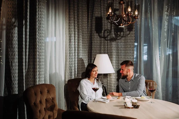 happy couple having dinner at restaurant