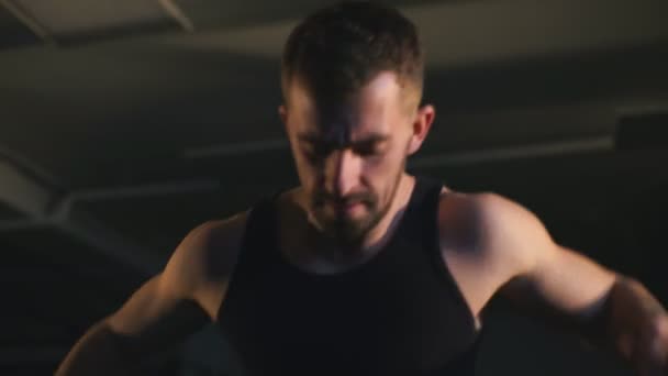 Bearded brutal athlete trains in the hall — Stock Video