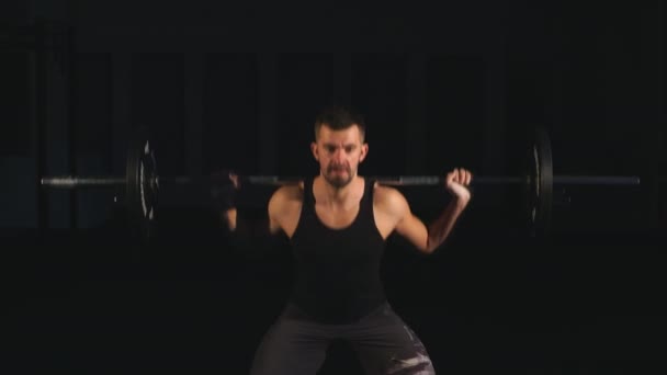 The weightlifter is preparing to lift a very heavy barbell. — Stock Video