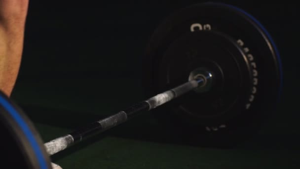 Man in gym. Muscular bodybuilder guy doing exercises with barbell. Strong person — Stock Footage Man in gym. Muscular bodybuilder guy doing exercises with barbell. Strong person Stock Footage