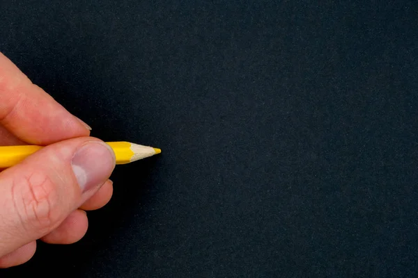 Hand Holding Yellow Pencil Black Background Close Copy Space — Stock Photo, Image