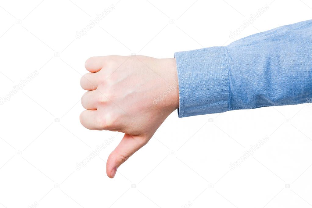 Thumb down male hand In blue shirt. On a white bakground. Isolated.