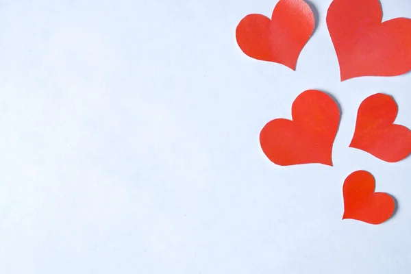 Blank sheet of pure white decorated with hearts in right for writing a message.