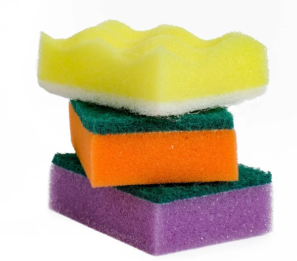 Foam sponges for washing dishes lie on each other isolated on white background. Stock Image