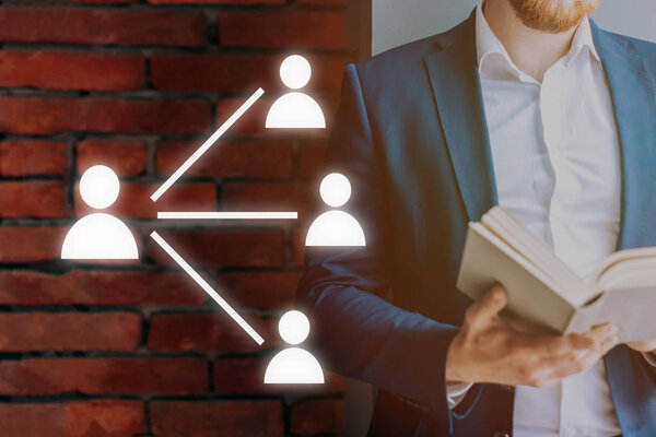 Leadership training. Icons of a man on the background of a man in a suit with a book.