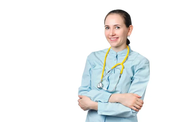 青いコートの医者の女性と白い背景に聴診器で — ストック写真