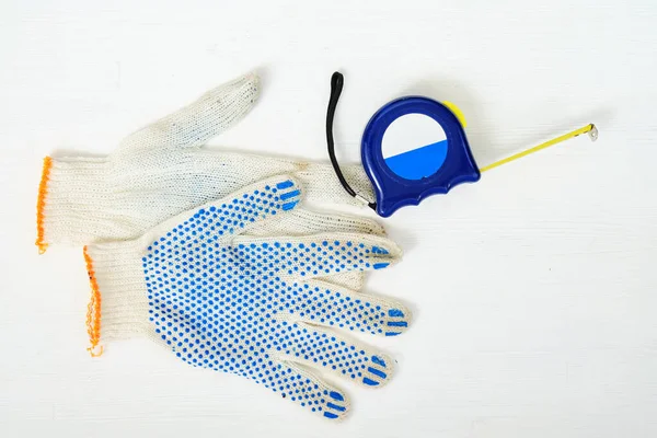 Repair Gloves Tape Measure Measuring White Wooden Background Top View — Stock Photo, Image