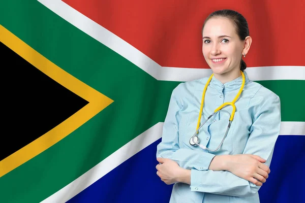 Republic of South Africa healthcare concept with doctor on RSA flag background. Medical insurance, work or study in the country