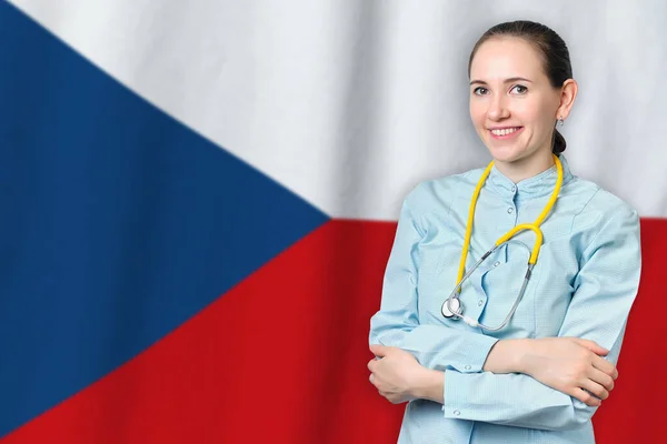 Czech Republic healthcare concept with doctor on Czechia flag background. Medical insurance, work or study in the country