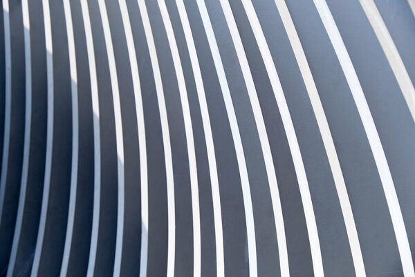 Abstract metallic lines with sun shadow. Close up.