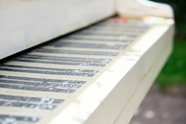 Abstract piano keys from a wooden piano in the street.