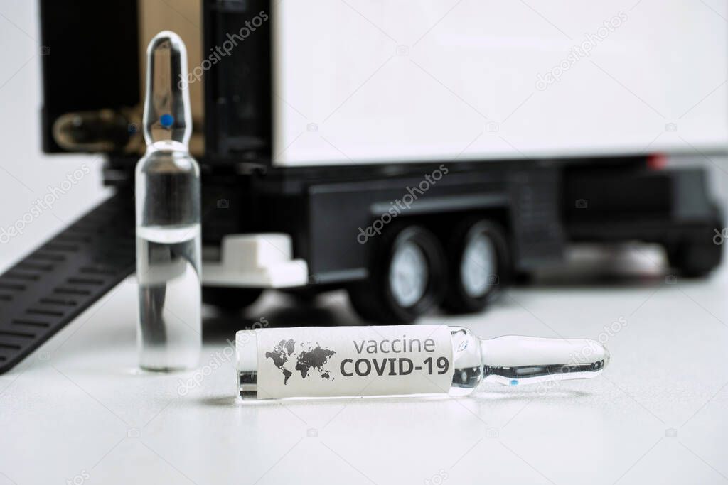 Concept for delivering coronavirus vaccine covid-19 in ampoules by truck.
