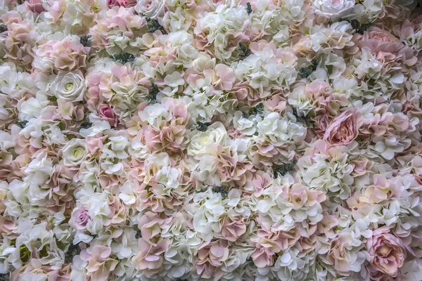 Wedding background of fresh flowers of white and pink roses. Can be used for wedding invitations, engagement, greeting cards and photo Wallpapers. Floral pattern.