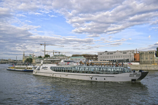 The ship sails on the river