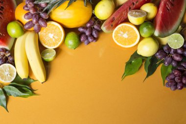 Tropical fruit on yellow background