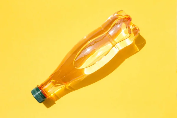 Mineral water bottle on yellow background